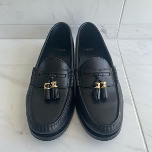 Lightly used Celine Triomphe leather loafers.